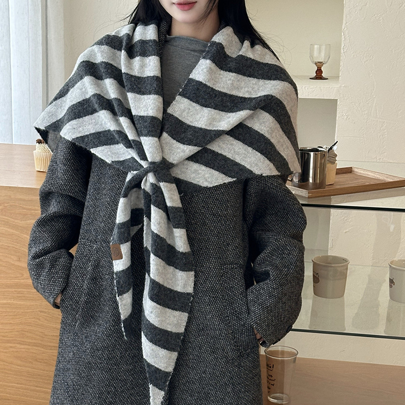 Aarenza women's solid color shawl draped over a shoulder, lightweight and versatile accessory for all seasons.