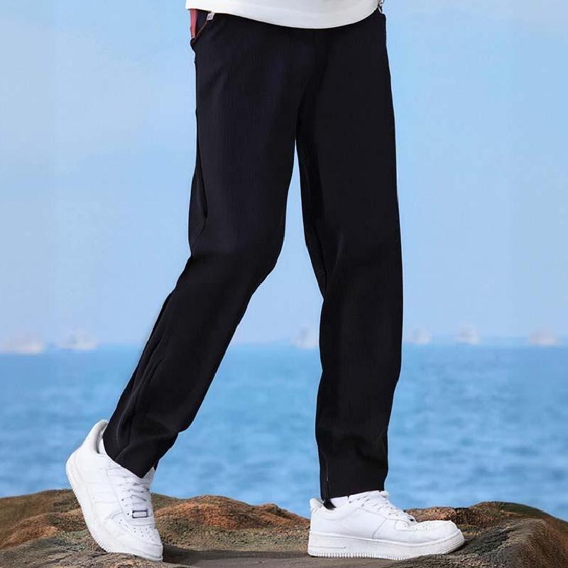 A pair of unisex solid color windproof thermal pants by Arenzza, designed for warmth and wind resistance, shown in a neutral color.