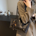A women's vintage PU leather shoulder bag from Arenzza with a classic design, featuring a structured shape and a shoulder strap.