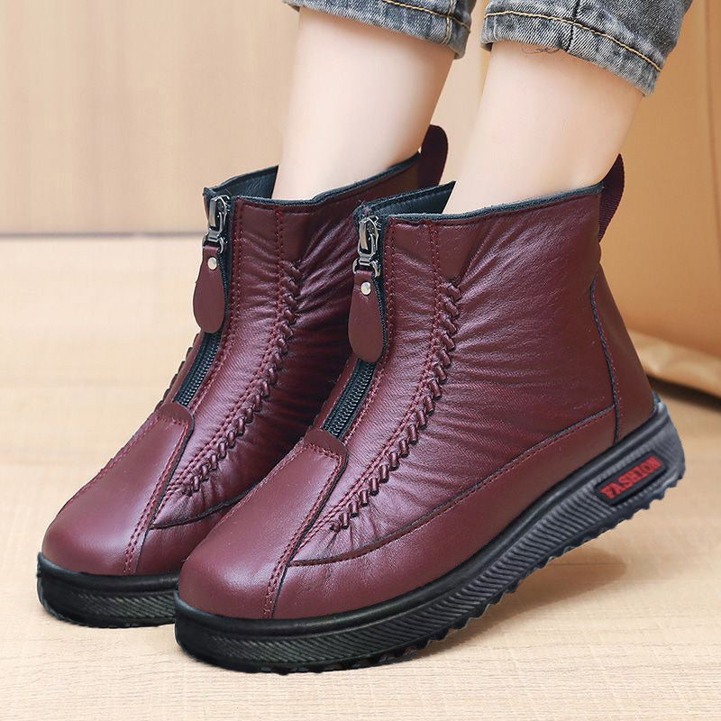 A pair of Arenzza women's winter ankle boots with side zippers, thermal insulation, water resistance, and stylish design.