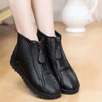 A pair of Arenzza women's winter ankle boots with side zippers, thermal insulation, and water-resistant material on a neutral background.