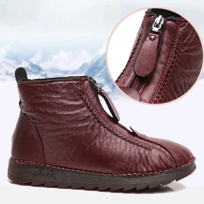A pair of Arenzza women's winter ankle boots with side zippers, thermal insulation, water resistance, and stylish design.