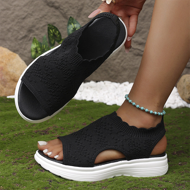 A pair of women's breathable knit platform sandals by Arenzza featuring open toes and chunky soles, perfect for warm weather.