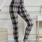 A pair of high-elasticity slim fit warm plaid leggings for women from Arenzza, featuring a cozy winter plaid pattern.