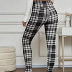 A pair of high-elasticity slim fit warm plaid leggings for women in red and black, designed for comfort and style.