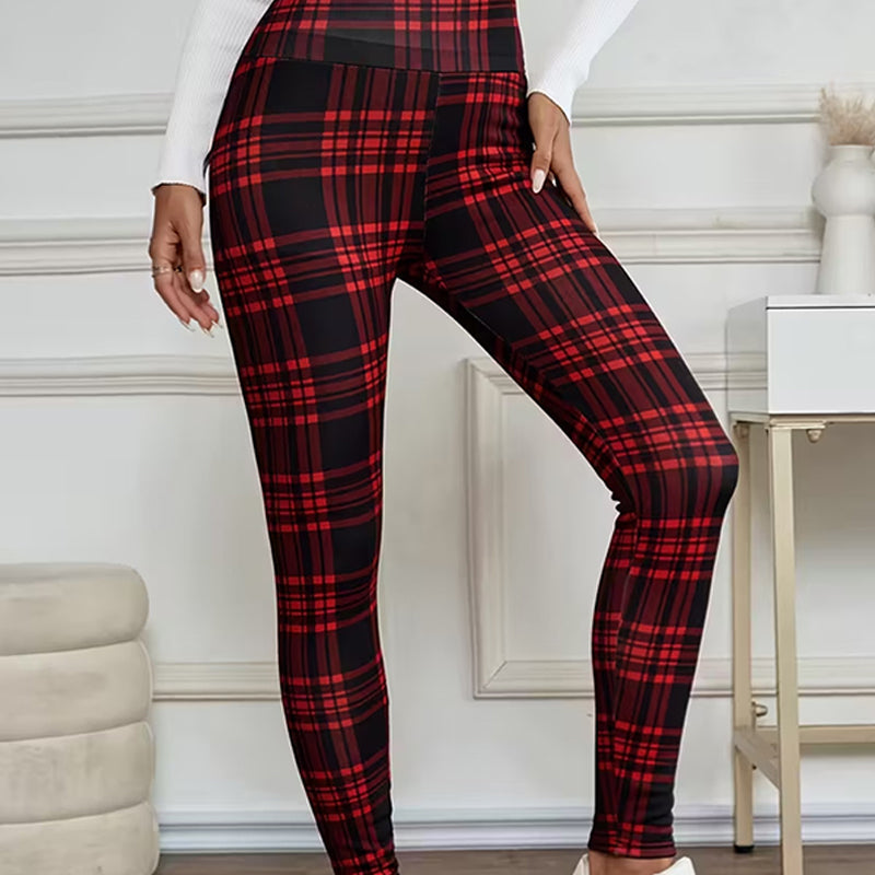 A woman wearing high-elasticity slim fit warm plaid leggings by Arenzza, showcasing their snug fit and stylish plaid pattern.