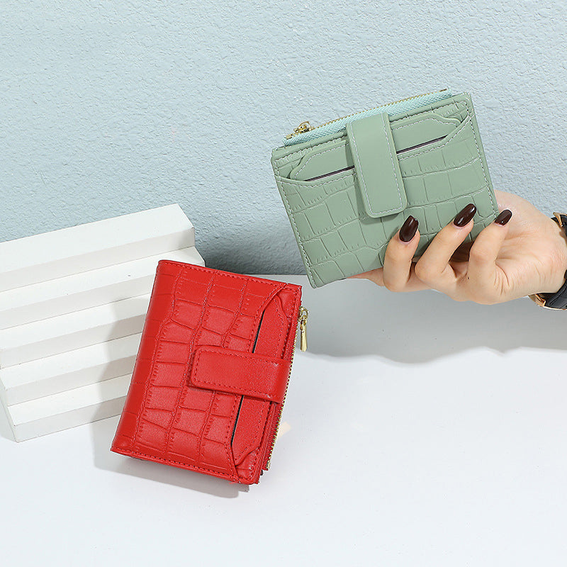 Aarenza women's compact solid color wallet in a sleek design, perfect for holding cards and cash, shown in a neutral color.