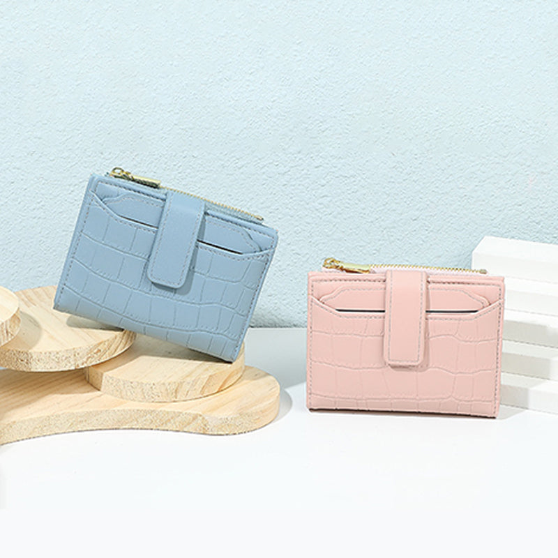 Aarenza women’s compact solid color wallet in a sleek, minimalist design, showcasing its smooth surface and compact size.