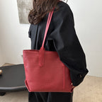 A Women's Retro Multifunctional Large Capacity Shoulder Bag by Arenzza featuring a stylish design and spacious interior for accessories.
