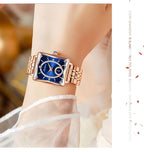 Aarenza square rose gold diamond ladies watch with a sleek design, featuring a round face and elegant metal band.