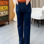 Women’s casual straight-leg pants by Arenzza, showing a close-up of the beige fabric and classic fit on a model.