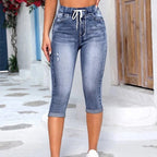 A pair of women's high waist casual drawstring jeans from Arenzza, featuring a relaxed fit and classic denim style.