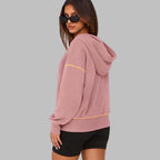 A women's hooded sweatshirt with half zip from Arenzza, featuring a cozy autumn design in warm colors.