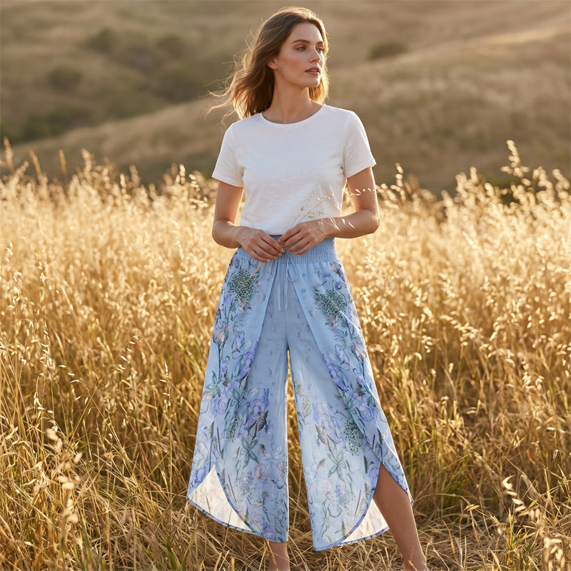 A pair of Arenzza women's floral print high-waist wide-leg pants in lightweight fabric, showcasing a vibrant floral pattern and relaxed fit.