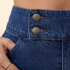 A pair of Arenzza women's high-waist wide-leg jeans displayed on a hanger, showcasing the relaxed fit and denim fabric.