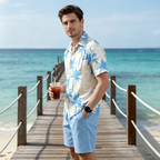 Men's tropical print shirt and shorts set by Arenzza, perfect for summer, featuring vibrant palm tree and beach-inspired designs.