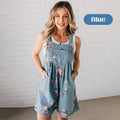 A woman wearing the Arenzza vintage floral printed denim jumpsuit featuring a fitted waist and long sleeves, perfect for casual wear.