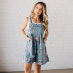 Aarenzza vintage floral printed denim jumpsuit with long sleeves and a fitted waist, showcasing colorful floral patterns and classic denim fabric.