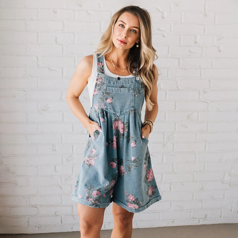 Aarenzza vintage floral printed denim jumpsuit with long sleeves and a fitted waist, showcasing colorful floral patterns and classic denim fabric.