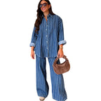 A woman wearing Arenzza casual striped shirt and matching pants set, showcasing relaxed fit and stylish striped design.
