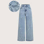 Women’s rhinestone embellished jeans by Arenzza featuring stylish, fitted denim with sparkling rhinestone details on the pockets.