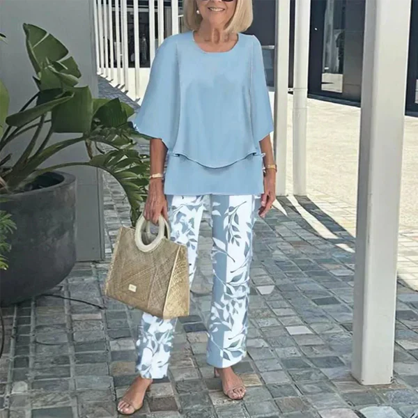 Aarenza women's casual two-piece set with printed top and matching pants, featuring a round neck and half sleeves.