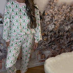 Arenzza cozy Christmas long-sleeve top and pants set for women, featuring festive holiday patterns in red and green.