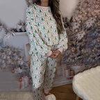 Aarenza cozy Christmas long-sleeve top and pants set for children, featuring festive red and green holiday patterns.