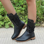 A pair of Arenzza women's lace-up low-heel ankle boots with round toes in black leather, featuring stylish design details.