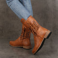 A pair of Arenzza women's lace-up low-heel ankle boots with round toes in black leather, stylish and comfortable footwear.