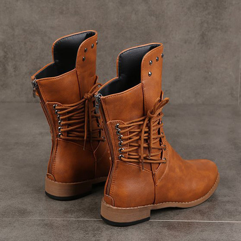 Women’s Arenzza lace-up low-heel ankle boots with round toe and stylish design, shown on a model.