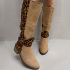 Women's leopard print riding boots by Arenzza, featuring tall silhouette and stylish animal print design.