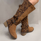 A pair of women's leopard print riding boots by Arenzza with brown and black animal print, stylish and knee-high for fashion and riding.