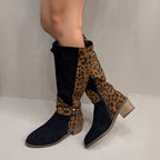 Women's leopard print riding boots by Arenzza, featuring tall leather design with animal print pattern and sturdy heel.