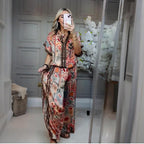 A woman wearing Arenzza’s printed top and wide-leg pants 2-piece set, showcasing stylish casual clothing with bold patterns.