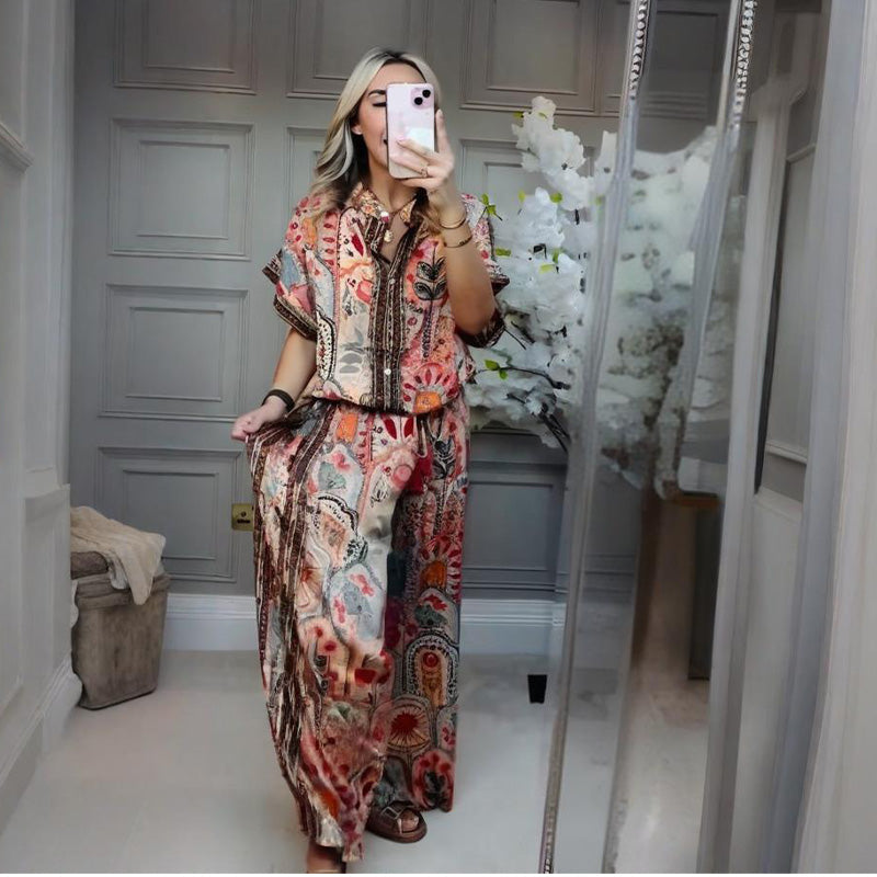 A woman wearing Arenzza’s printed top and wide-leg pants 2-piece set, showcasing stylish casual clothing with bold patterns.