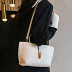 Aarenza women's elegant solid color French style handbag with gold-tone hardware, featuring a structured design and top handle.