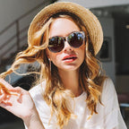 A pair of oversized cat eye sunglasses by Arenzza with polarized UV400 protection, featuring black frames and dark lenses.