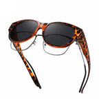 A pair of oversized cat eye sunglasses by Arenzza with polarized UV400 protection, featuring black frames and tinted lenses.