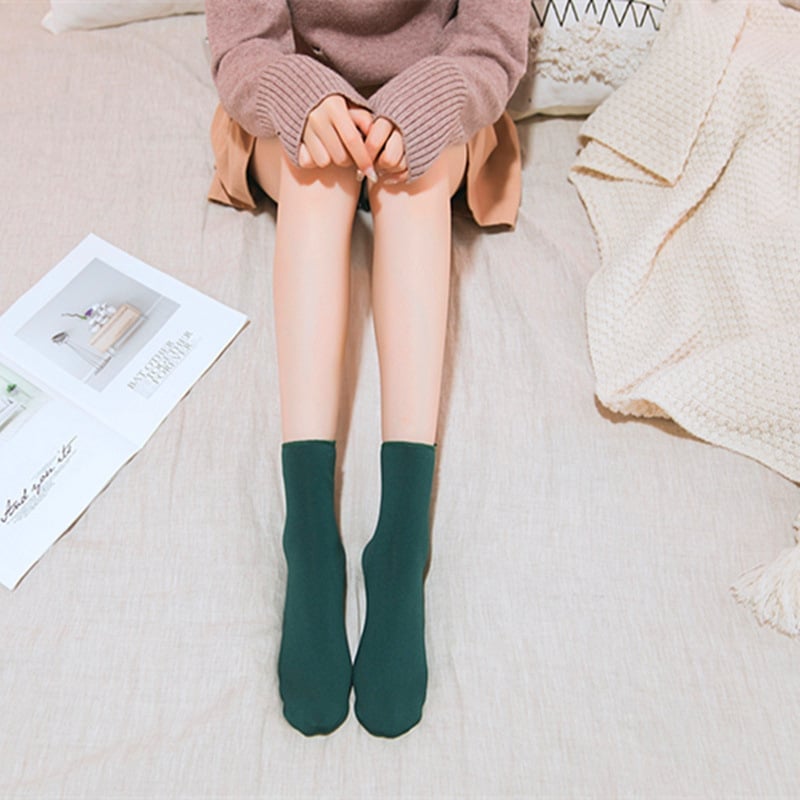 A pair of Arenzza winter thermal socks in cozy, warm fabric, perfect for cold weather, with a festive floral pattern.