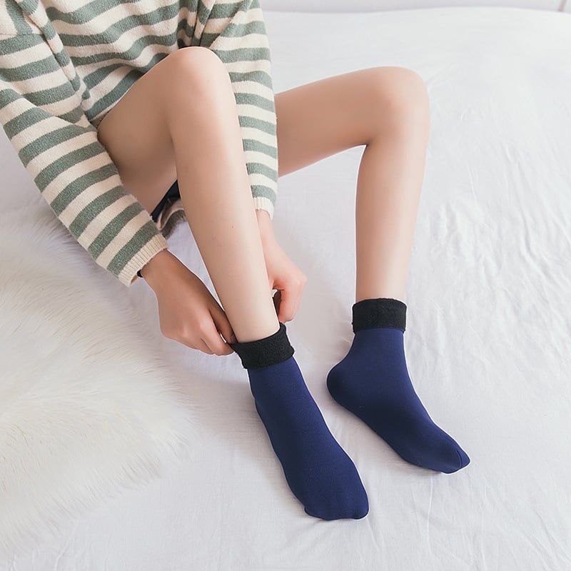 A pair of Arenzza Snugly Winter Thermal Socks in cozy knit, designed for warmth and comfort during cold weather.