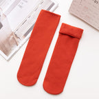 A pair of Arenzza Snugly Winter Thermal Socks in cozy, thick fabric designed for warmth and comfort during cold weather.