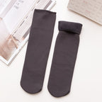A pair of Arenzza winter thermal socks in cozy, patterned fabric designed for warmth and comfort during cold weather.