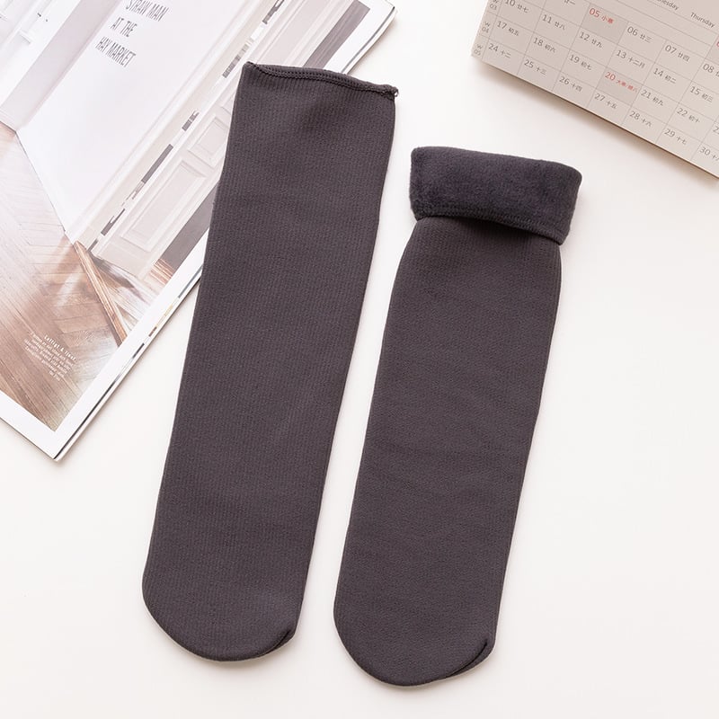 A pair of Arenzza winter thermal socks in cozy, patterned fabric designed for warmth and comfort during cold weather.