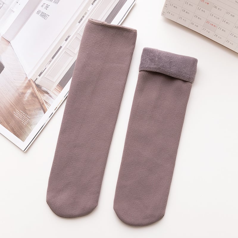 A pair of Arenzza winter thermal socks in cozy, warm fabric, perfect for cold weather, displayed in a close-up shot.