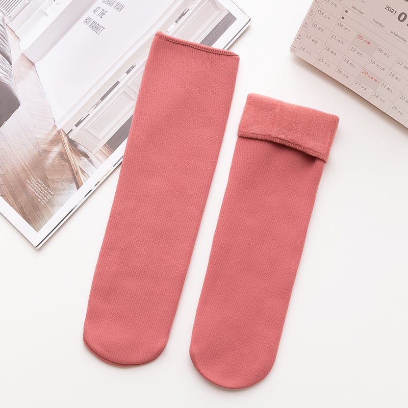 A pair of Arenzza winter thermal socks in cozy, thick fabric with a festive pattern, perfect for cold weather.