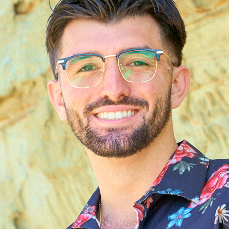 A pair of Arenzza fashion half-frame eyewear with black and gold accents, stylishly displayed on a white background.