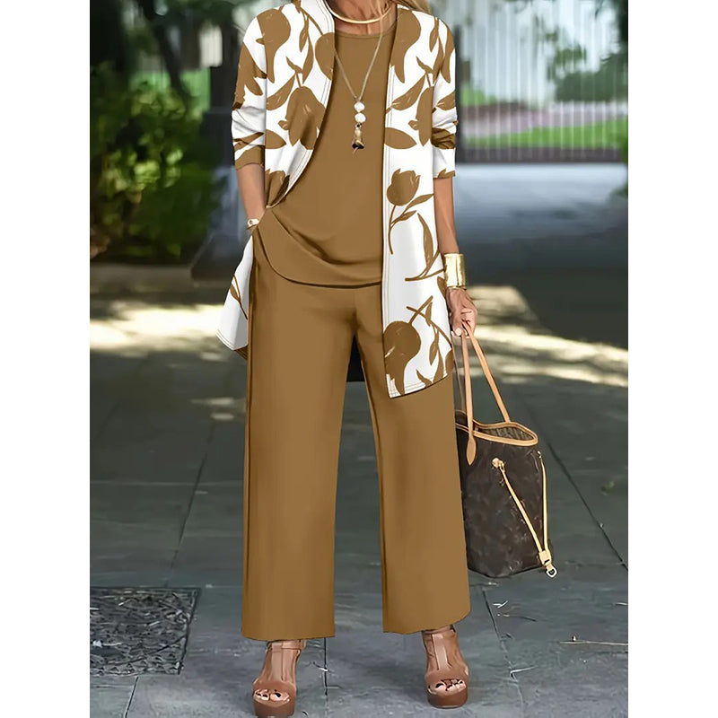 A women’s casual three-piece outfit set by Arenzza featuring a comfortable top, pants, and jacket in soft fabric, perfect for everyday wear.