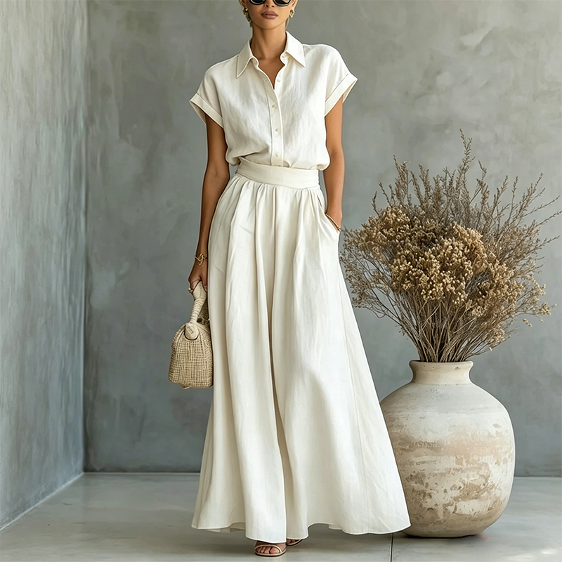A woman wearing the Arenzza elegant two-piece shirt and wide-leg pants set, featuring a stylish blouse and flowing trousers.