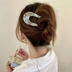 A pair of U-shape Arenzza women’s hairpins and hair clips with sleek metallic finish, suitable for securing hairstyles.
